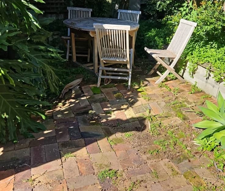 Uneven pavers and failed bedding before restoration