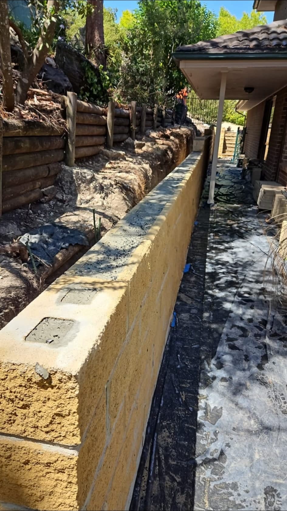 Replacement wall being rebuilt along the retained run