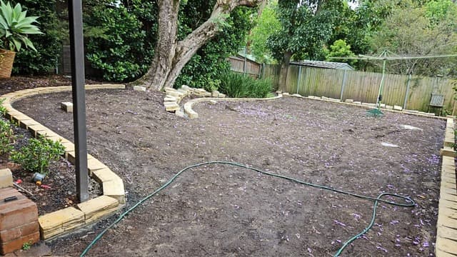 Block edging installed between lawn and garden bed