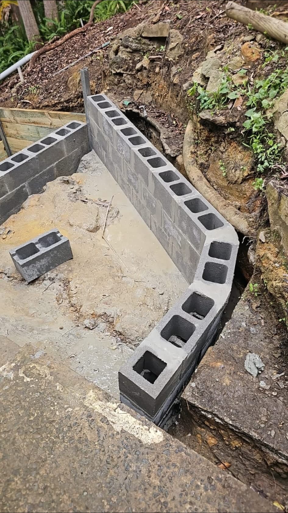 Old wall sections removed before new retaining work