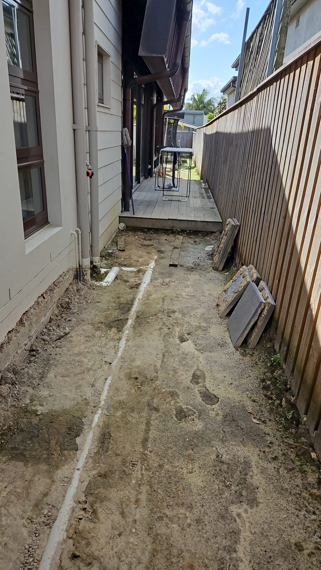 Worn lawn and access areas before the overhaul