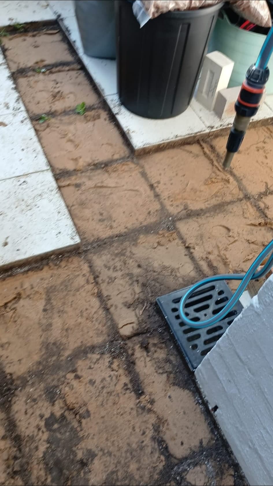 Old pathway pavers lifted before base preparation
