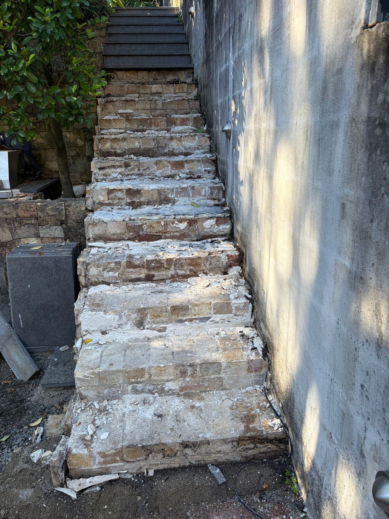 Stripped stairway after the old paving was removed