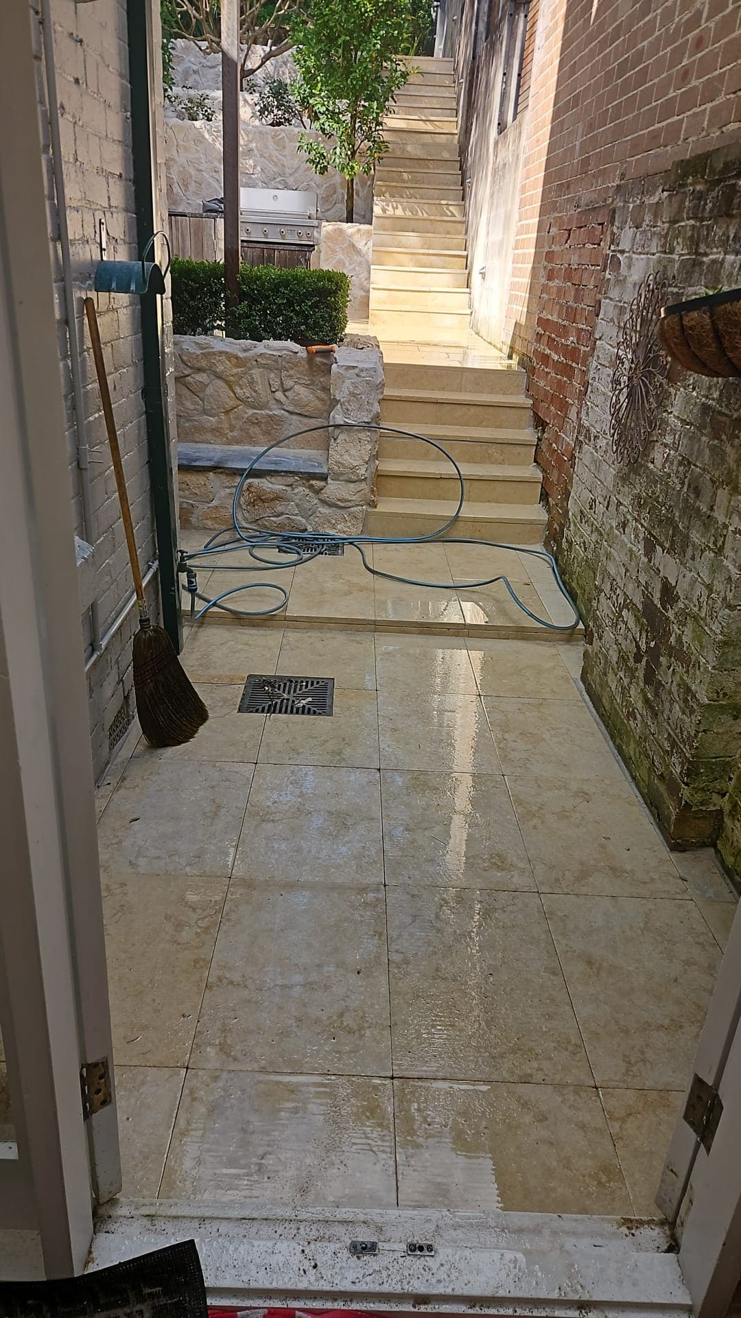 Finished side-passage paving with the drainage point visible