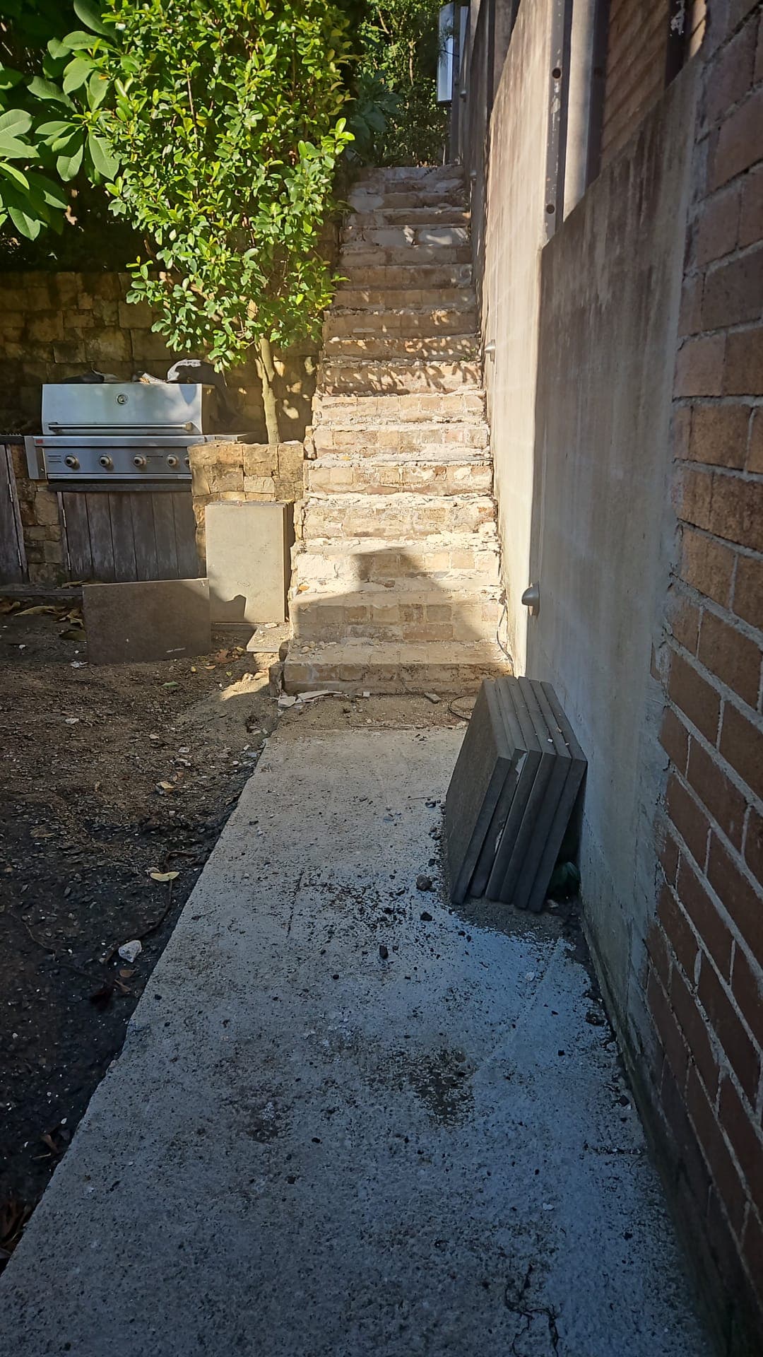 Old side-passage paving before replacement