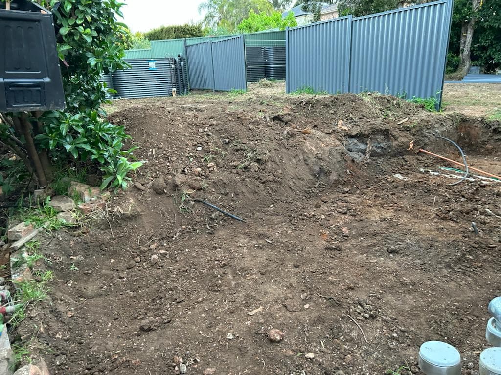 Ryde yard before retaining, turf, and edging work