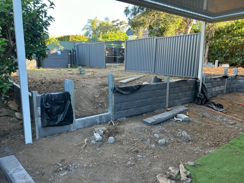 Retaining structure installed before turf preparation