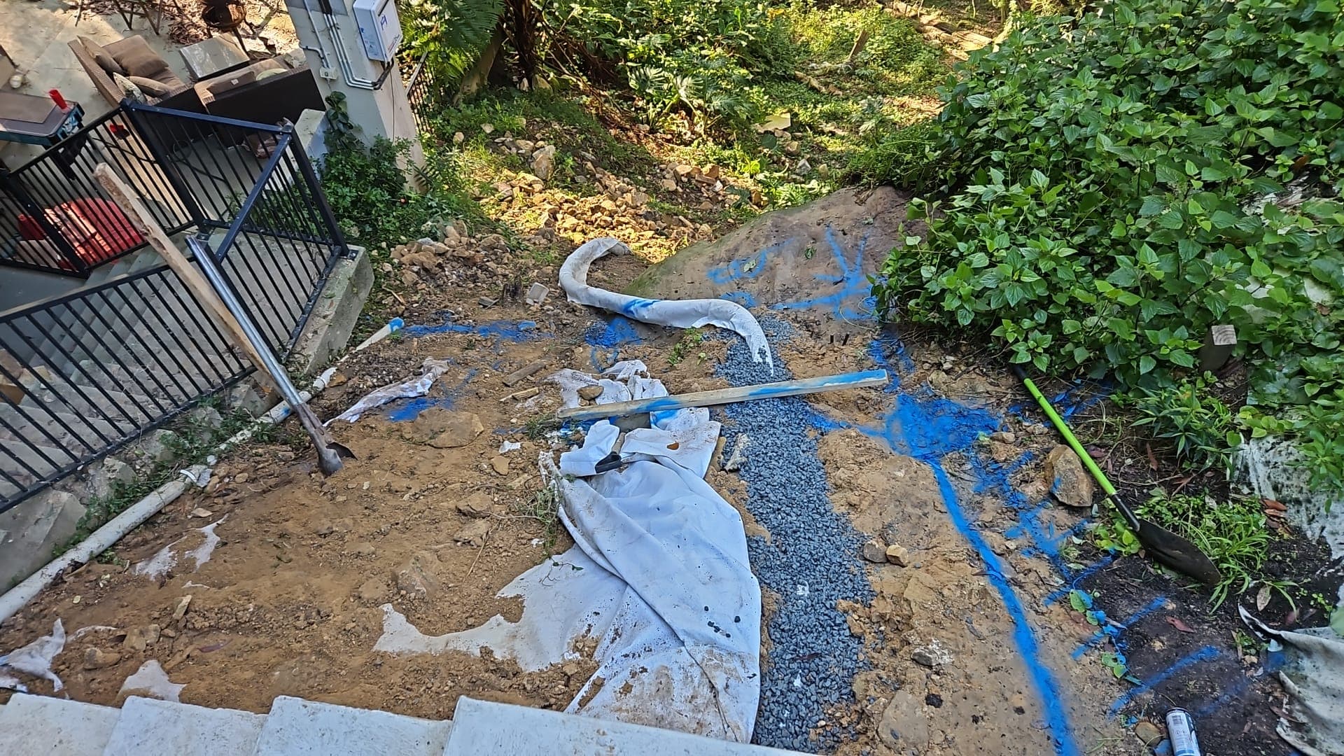 Timber retaining wall construction underway